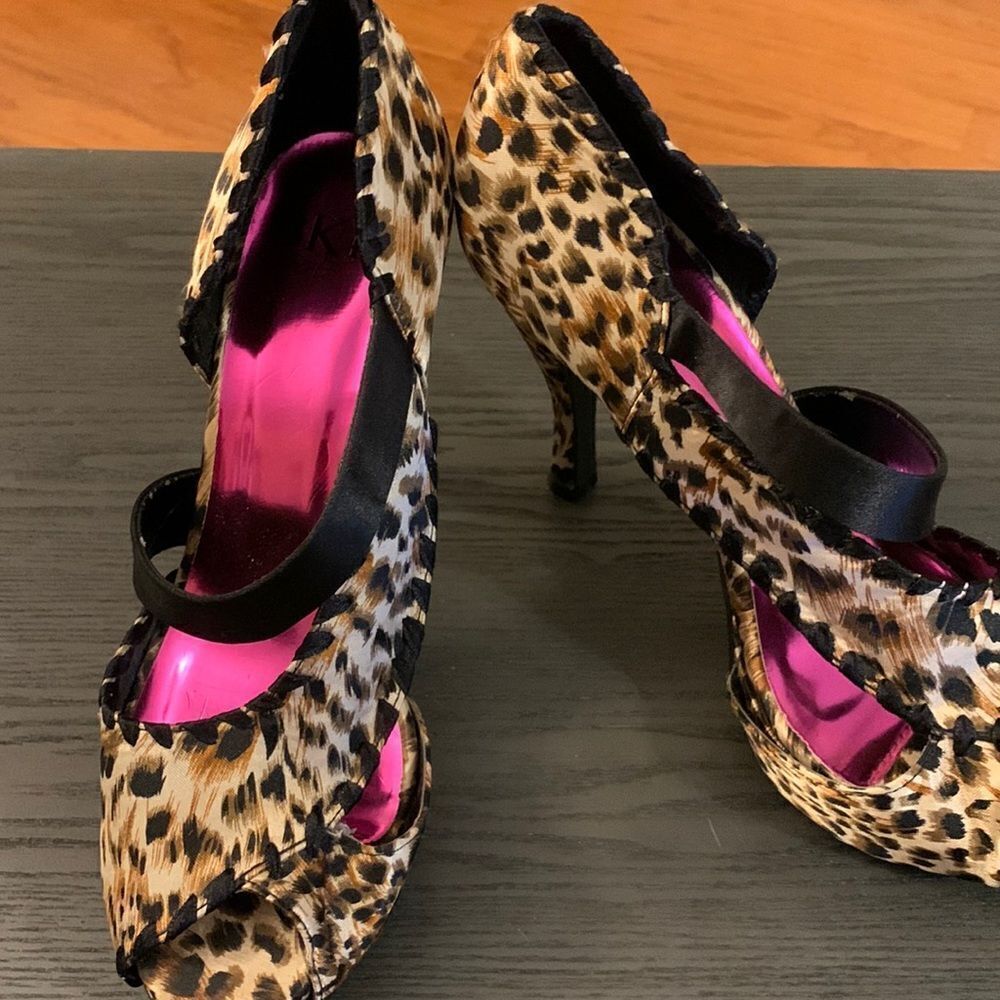 BKE Size 7 platform open toe strappy heels.  Animal print